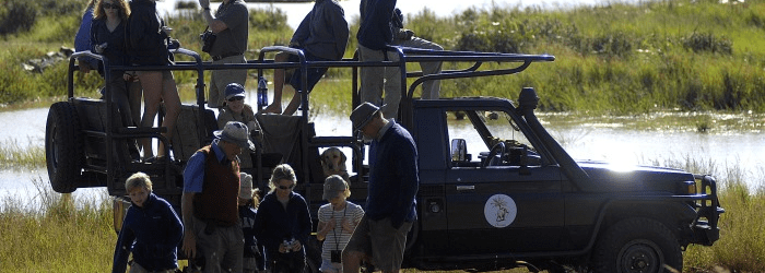 Children on game drive at Sosian Lodge, Laikipia, Kenya.