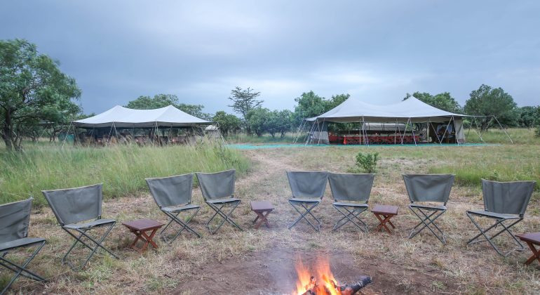 Snwc Camp Fire And Tents Behind